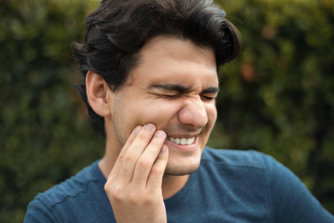 a man looking for quick relief from gum pain