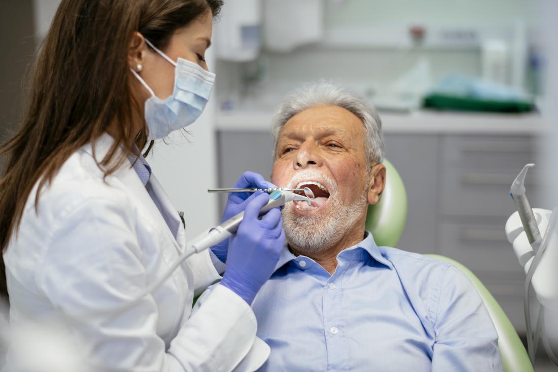 senior man at the dentist